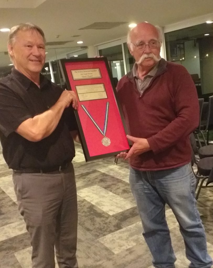 Lance Perham presenting Dave Theyers with his Perham Medallion